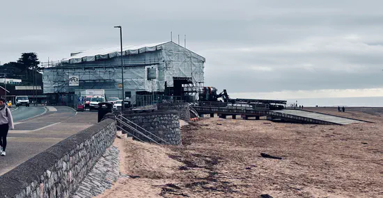 A photograph of Exmouth Lifeboat Station. It's wrapped in scaffolding and sheets while the roof is replaced.